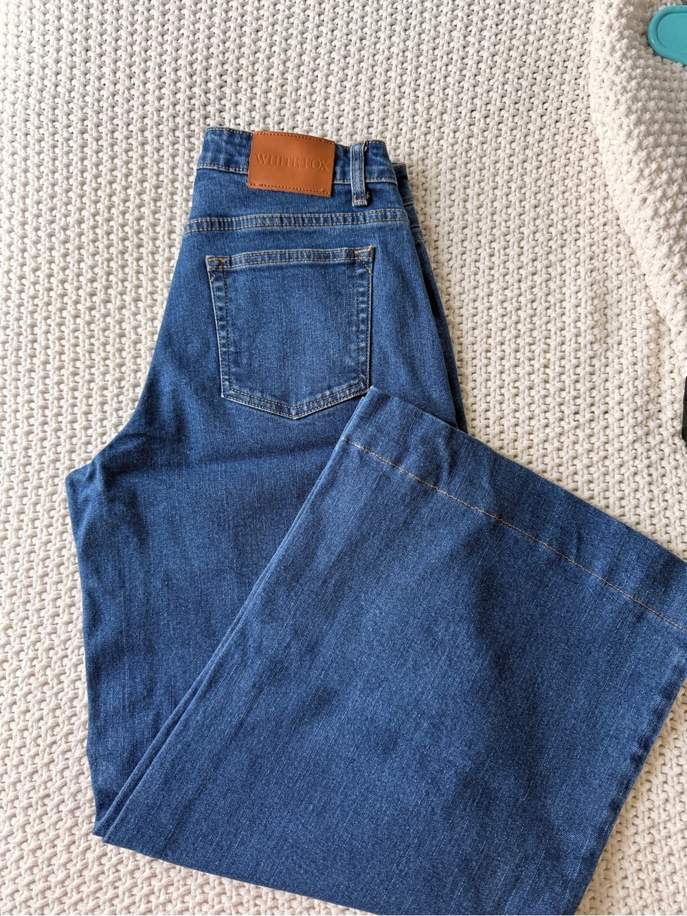 White Fox Boutique Blue Wide Leg Jeans with Leather Patch